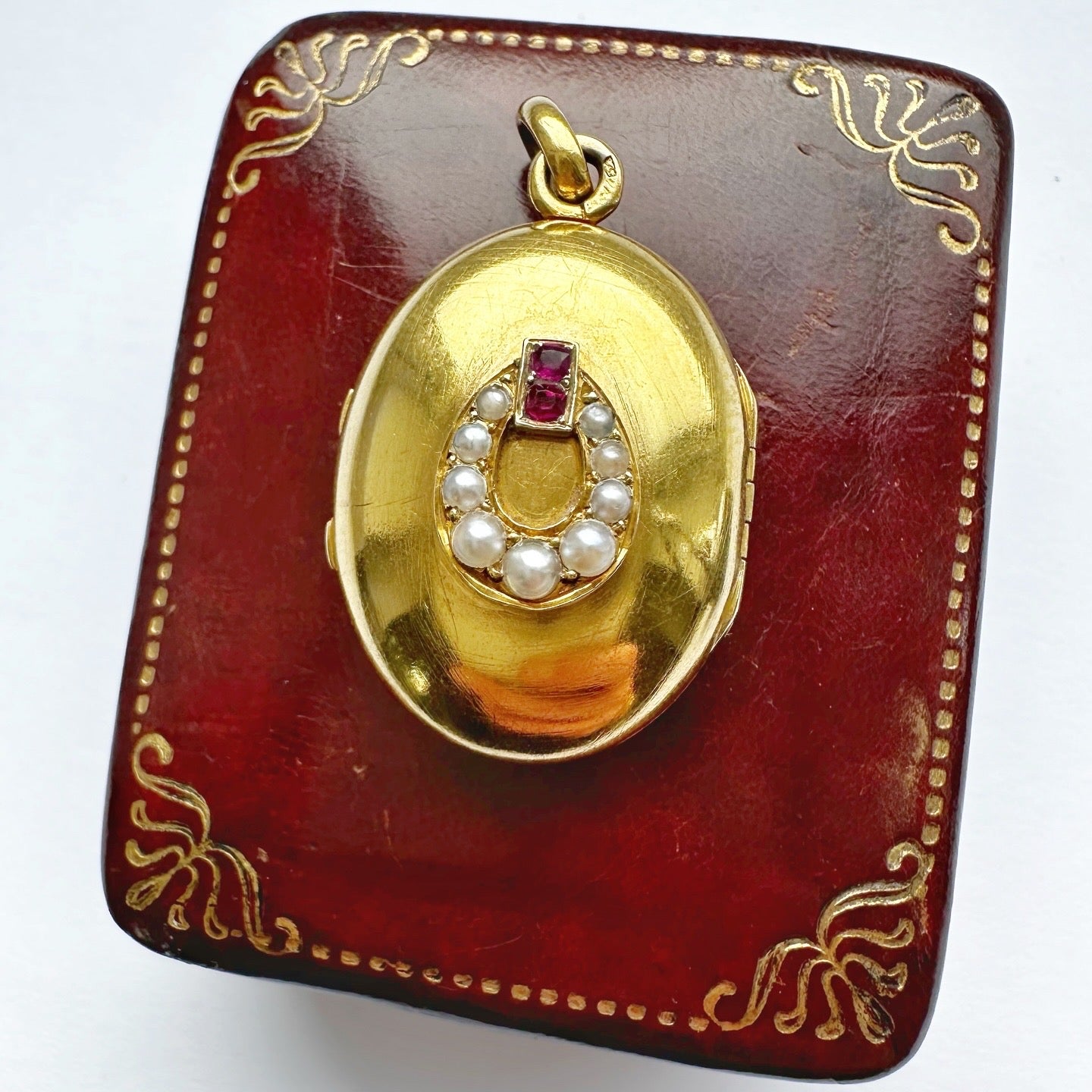 Antique 18ct gold, ruby & seed pearl locket