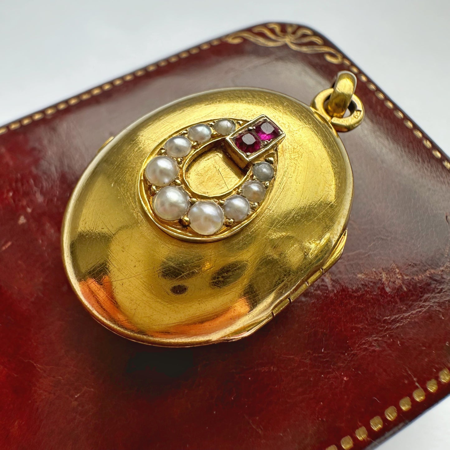 Antique 18ct gold, ruby & seed pearl locket