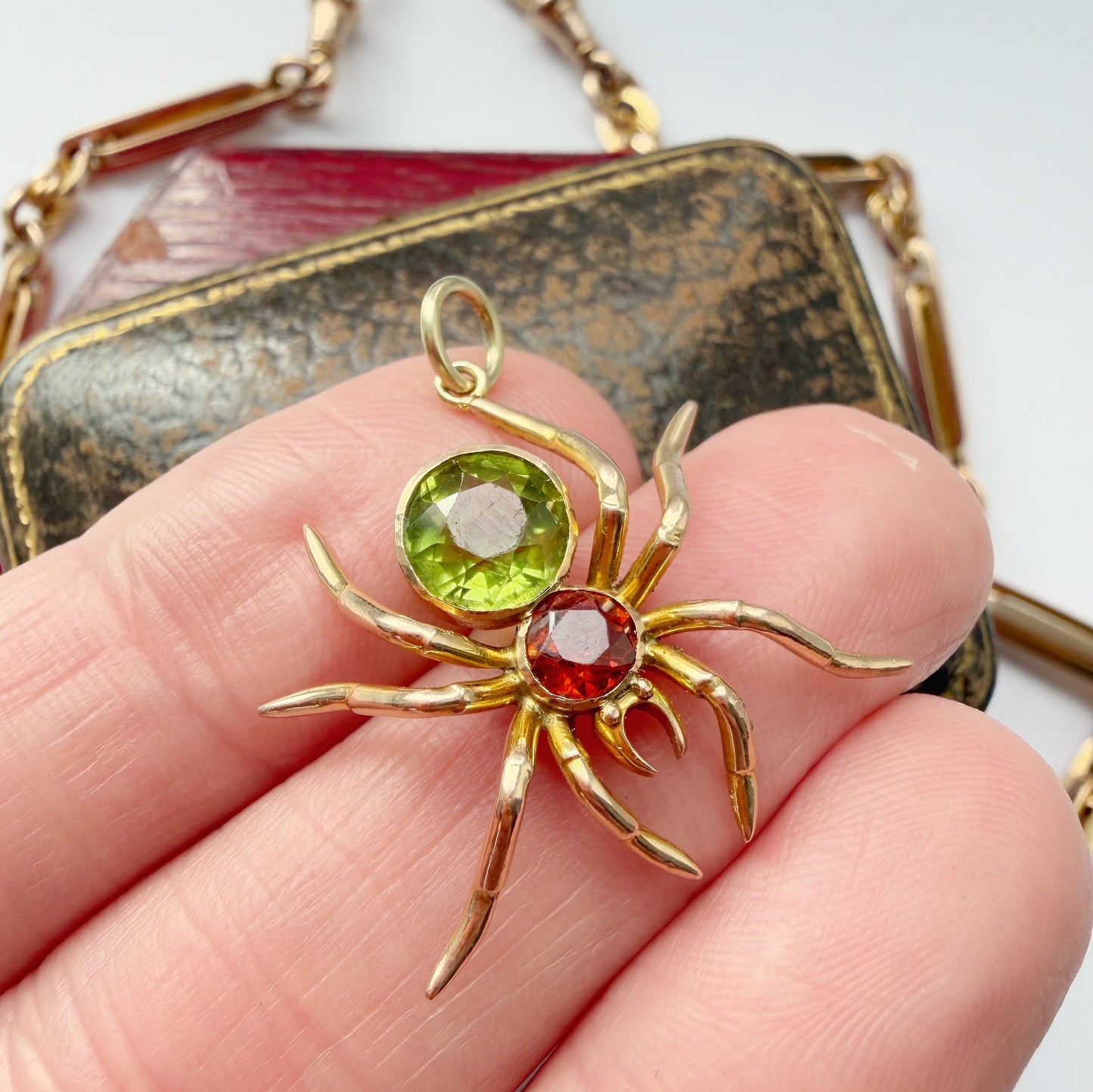 Antique 15ct gold, peridot & garnet spider pendant
