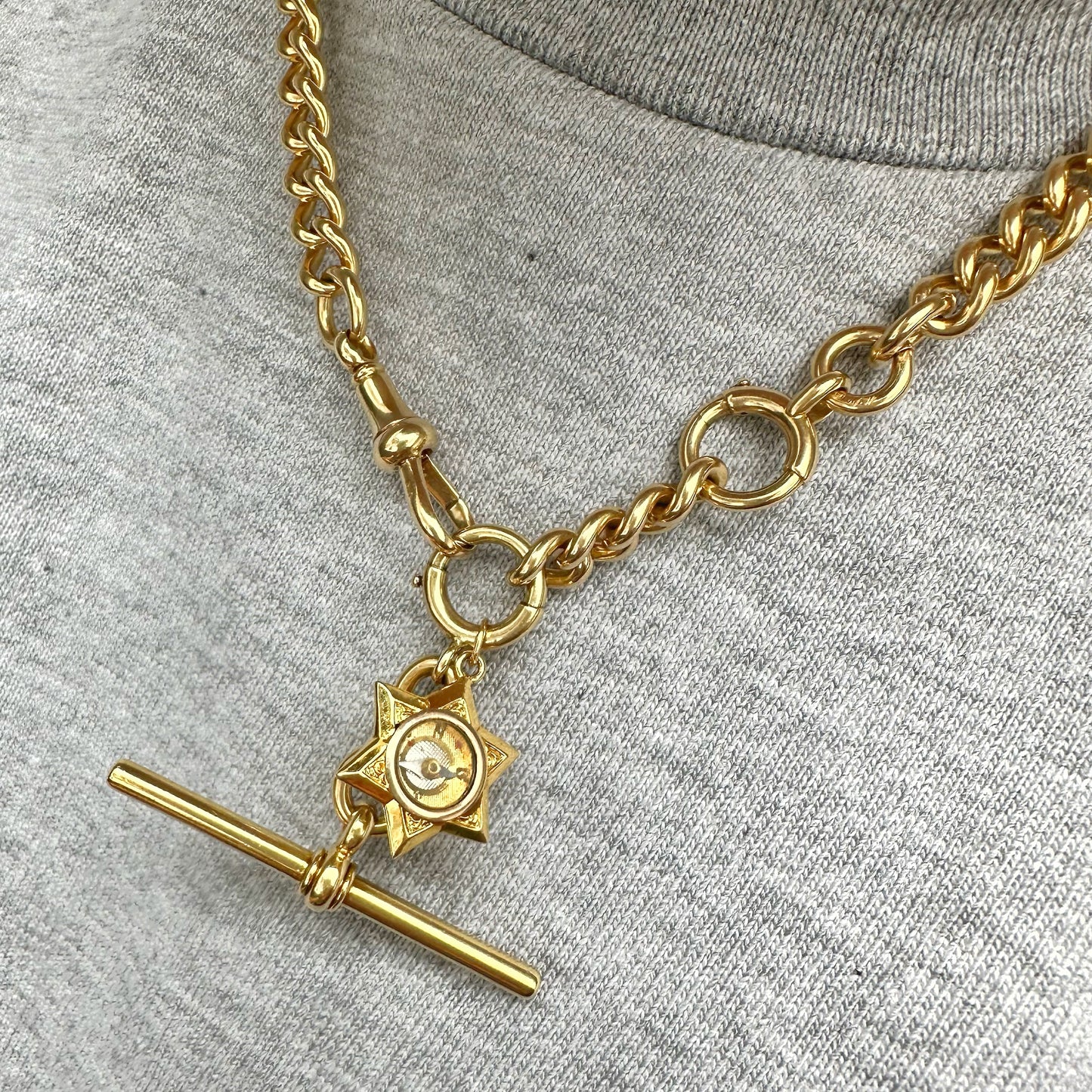 Antique 18ct gold star compass charm