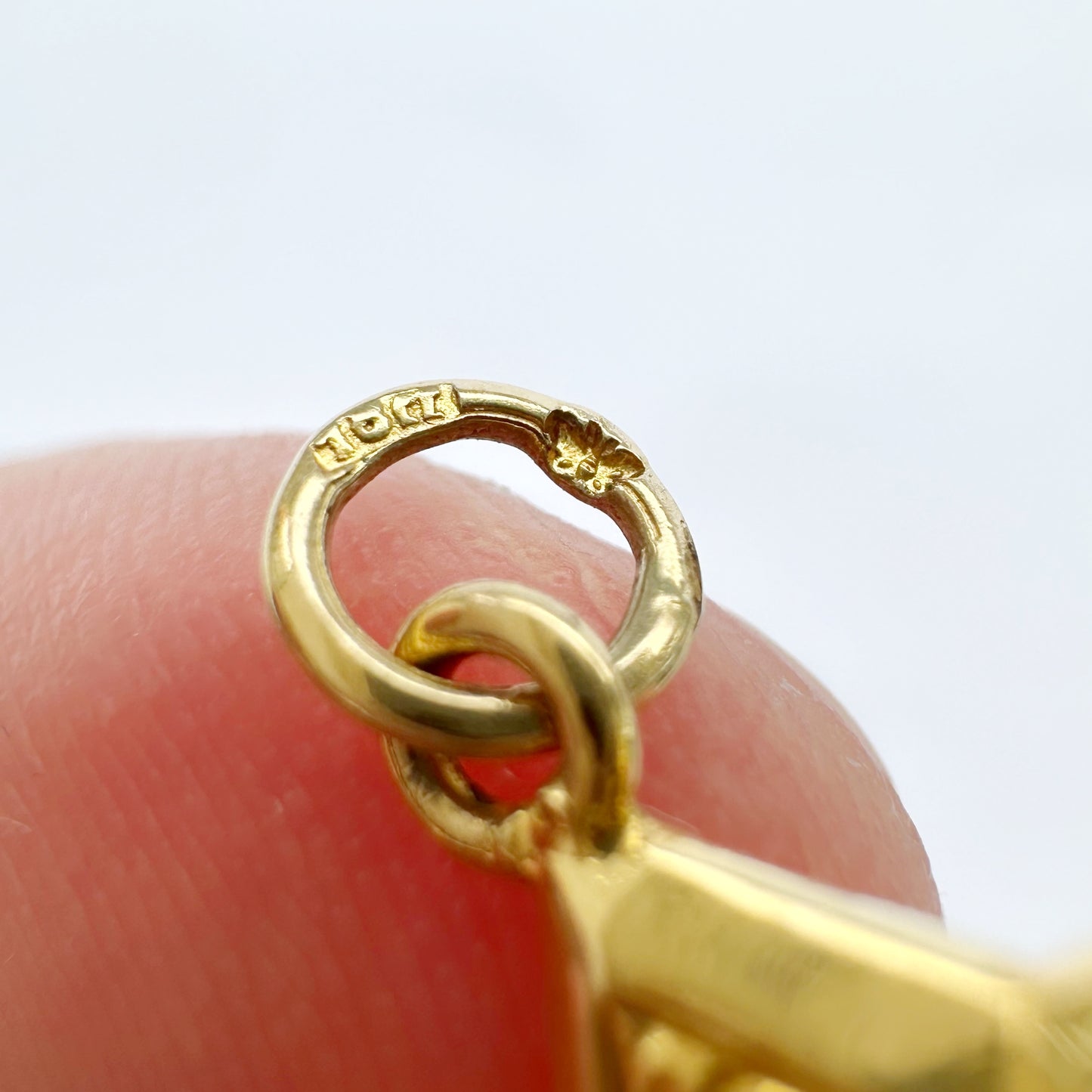 Antique 18ct gold star compass charm