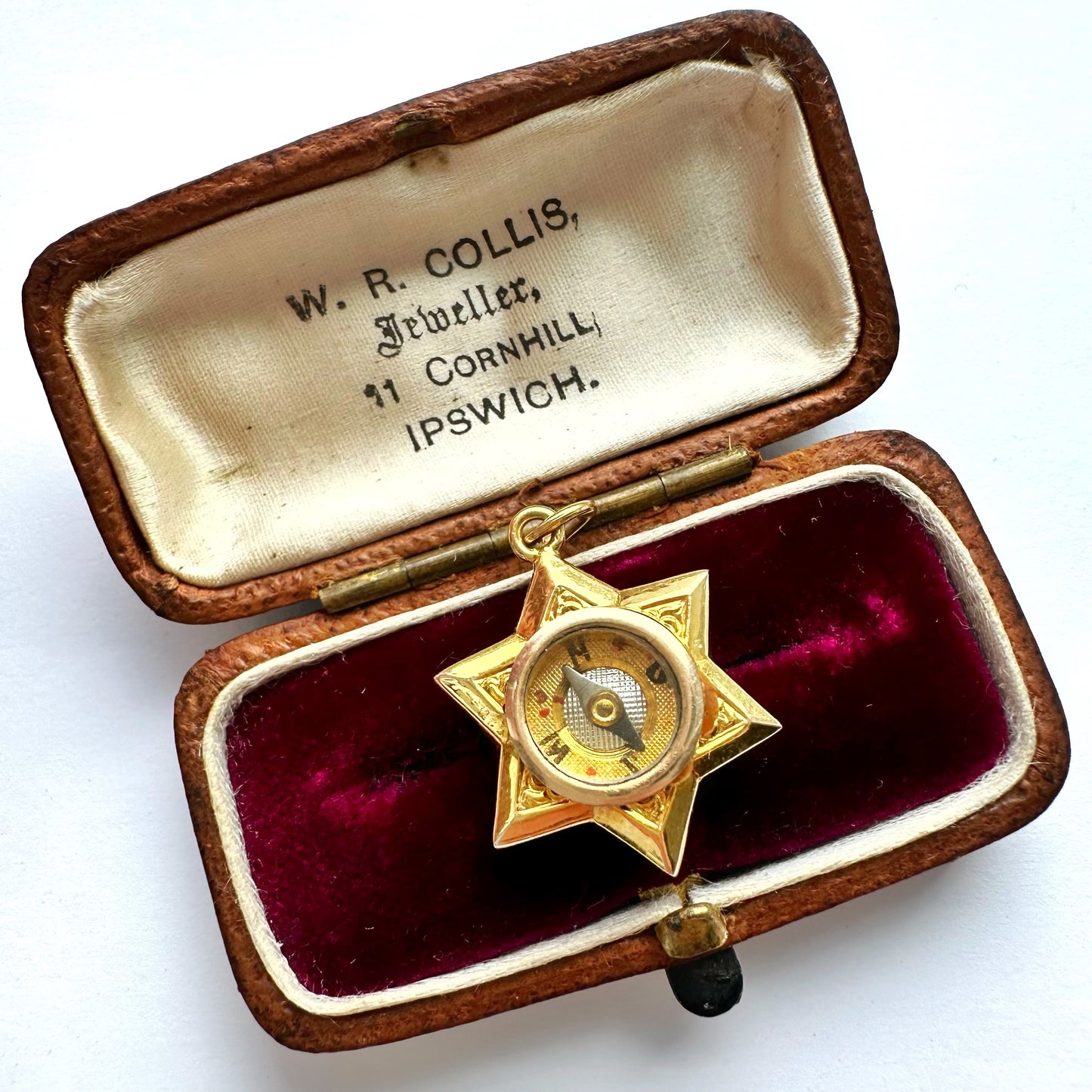 Antique 18ct gold star compass charm
