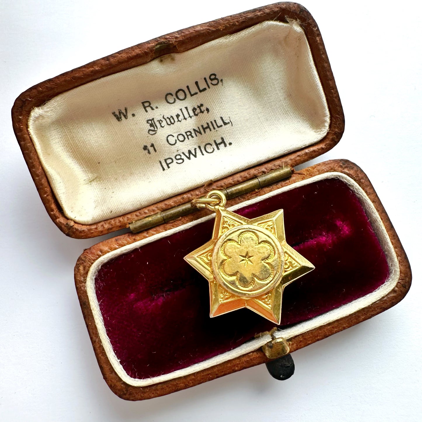 Antique 18ct gold star compass charm