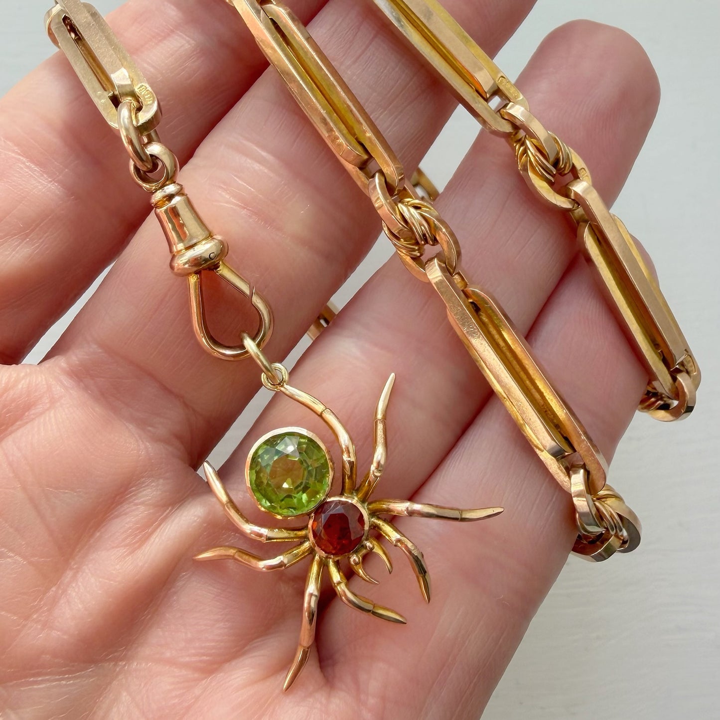Antique 15ct gold, peridot & garnet spider pendant