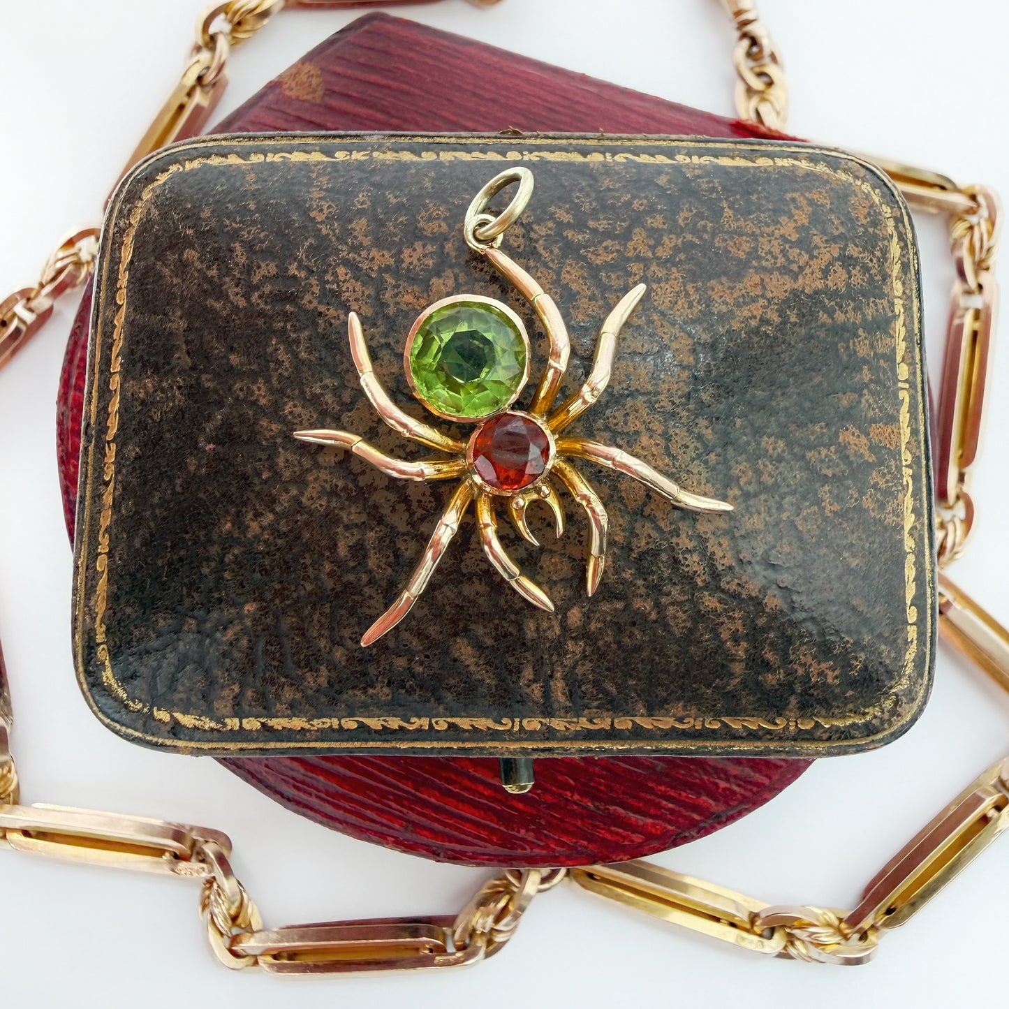 Antique 15ct gold, peridot & garnet spider pendant