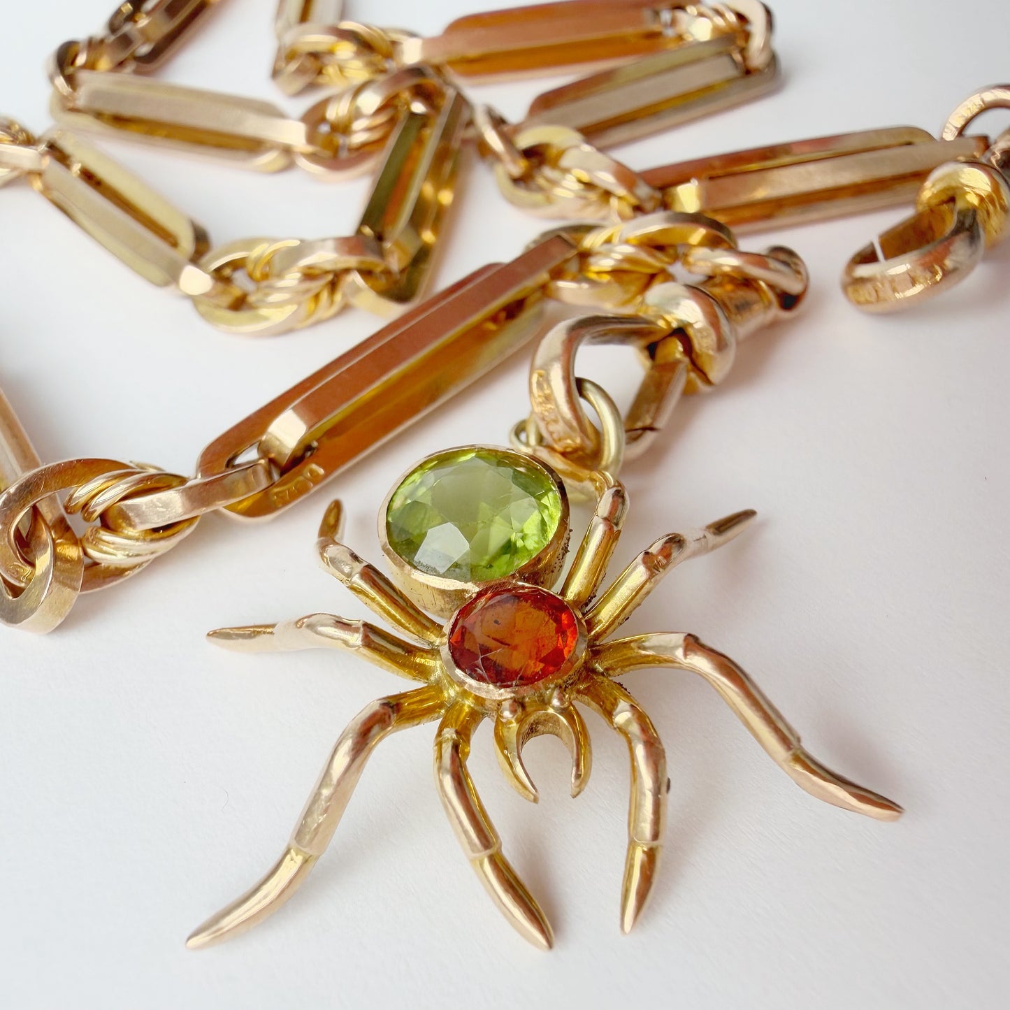 Antique 15ct gold, peridot & garnet spider pendant