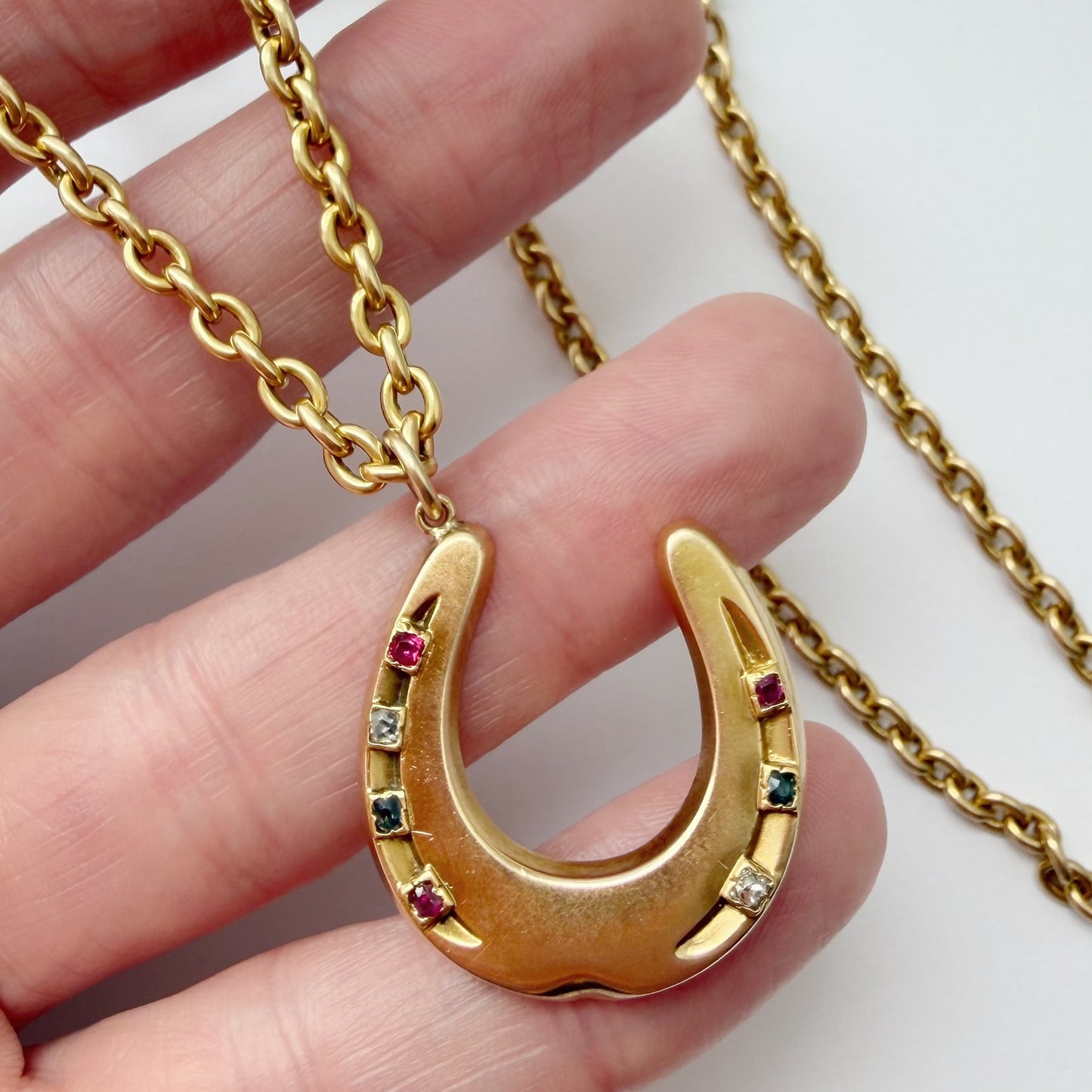 Antique 15ct gold & mixed gemstone horseshoe pendant