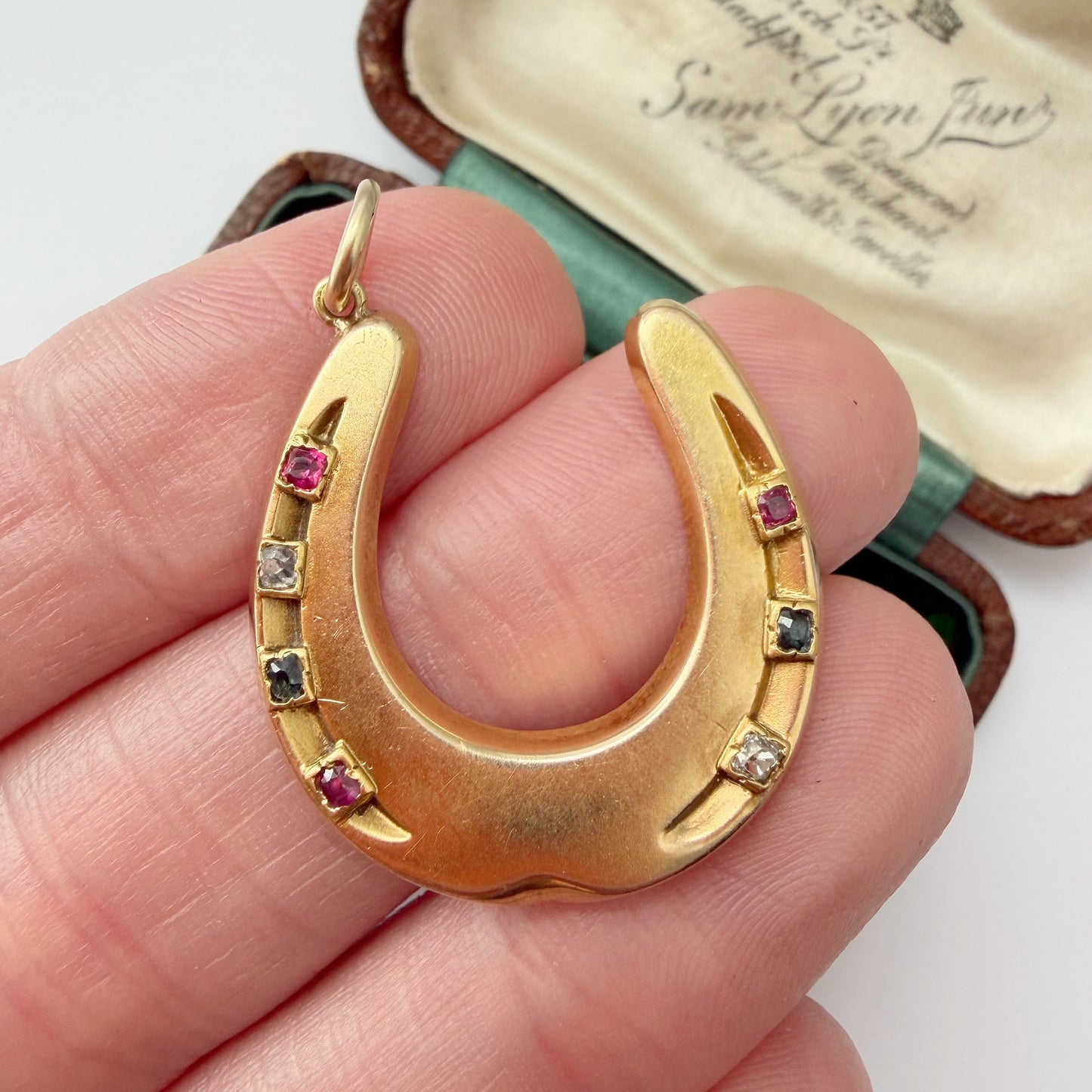 Antique 15ct gold & mixed gemstone horseshoe pendant