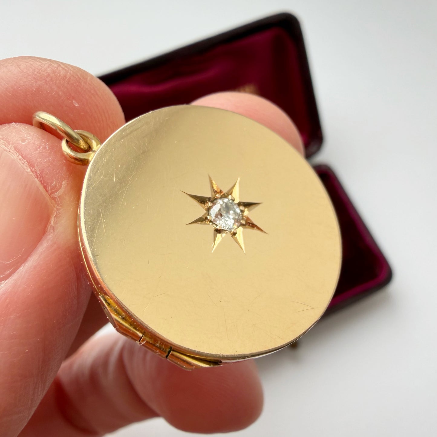 Antique 15ct gold & old cut starburst diamond locket